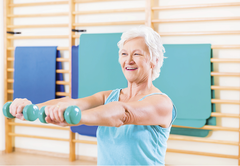 Senior woman doing fitness sport in gym
